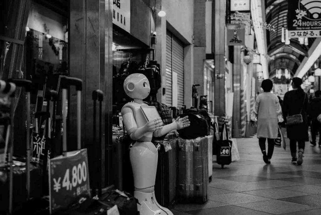 A humanoid robot standing outside a shop. Financial Alchemy by Thomas Stray