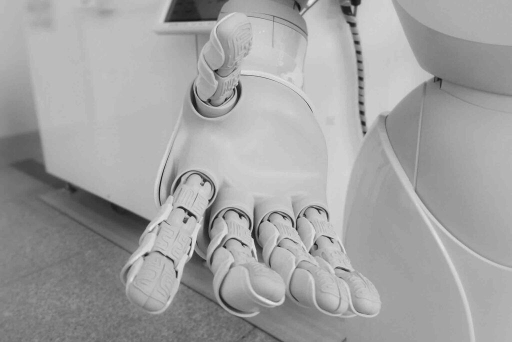 the hand of a humanoid robot that has artificial intelligence. Financial Alchemy by Thomas Stray